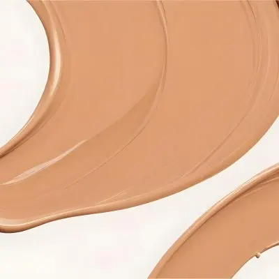 A Line Of Light Brown Liquid Foundation Isolated On A White Background With A Smooth And Slightly Glossy Texture Used For Cosmetics 9 B98c