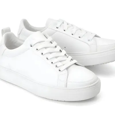A Pair Of White Sneakers With White Laces White Sole White Background 25 5146