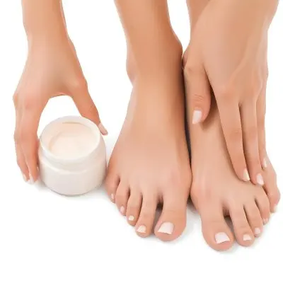 A Pair Of Woman S Feet With Fair Skin And A Hand Holding A White Jar With Cream On A White Background 6 14cb