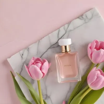 A Perfume Bottle On A Marble Tile Surrounded By Pink Tulips With Green Leaves All Against A Green Background 21 1024