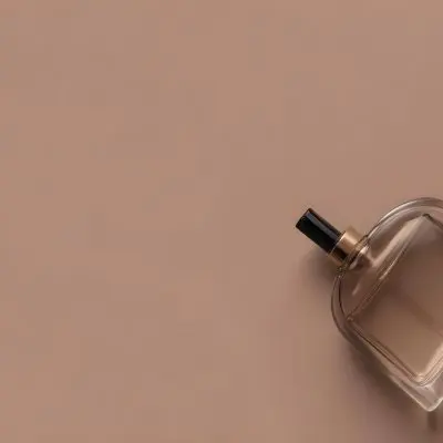 A Perfume Bottle With A Black Spray Nozzle On A Plain Black Background The Bottle Is Clear And Partially Filled With Liquid 30 7b49