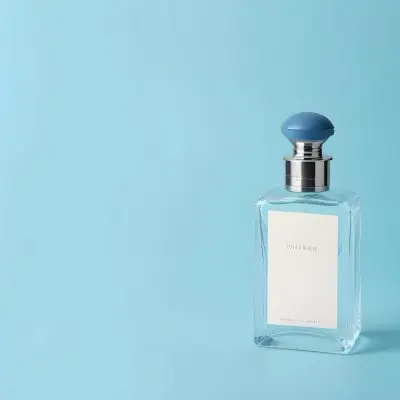 A Perfume Bottle With A Blue Cap And A Blue Label On A Light Blue Background 4 7676