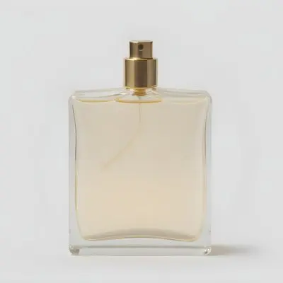 A Perfume Bottle With A Golden Cap And A Clear Glass Body Filled With A Clear Liquid On A White Background 18 1c71