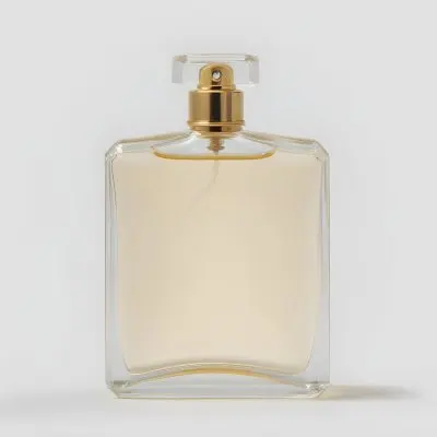 A Perfume Bottle With A Golden Cap And A Clear Glass Body Filled With A Clear Liquid On A White Background 9 5a09