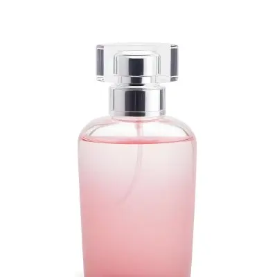 A Perfume Bottle With A Pink Cap And A Pink Liquid Inside On A White Background 4 Ab70