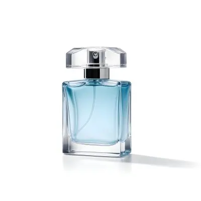 A Perfume Bottle With A Silver Cap And A Transparent Nozzle The Bottle Is Filled With A Light Blue Liquid White Background 3 Af38