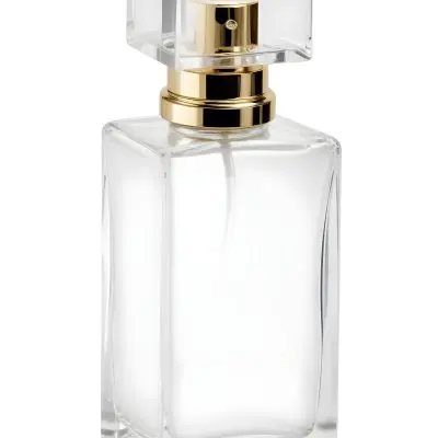 A Perfume Bottle With A White Cap On A White Background The Bottle Is Transparent And Rectangular The Liquid Inside Is White 20 Fe6e