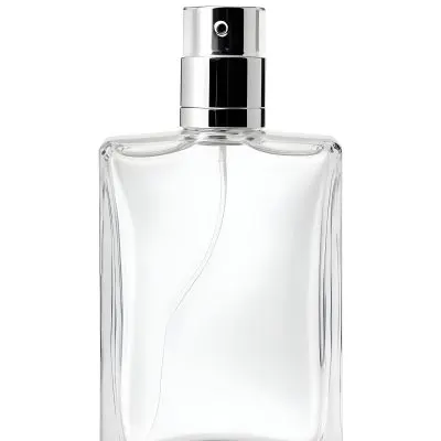 A Perfume Bottle With A White Cap On A White Background The Bottle Is Transparent And Rectangular The Liquid Inside Is White 25 000d