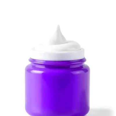 A Purple Jar With A Swirl Of White Cream Coming Out Of It Isolated On A White Background Product Photography Studio Shot 18 C693