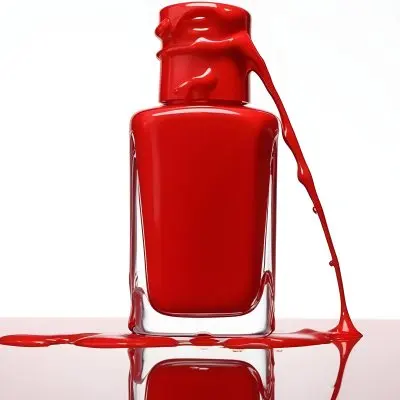 A Red Nail Polish Bottle With Nail Polish Dripping Down The Side On A Red Background 2 2379