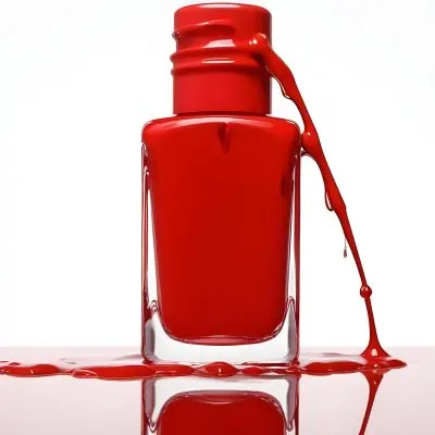 A Red Nail Polish Bottle With Nail Polish Dripping Down The Side On A Red Background 4 3f09