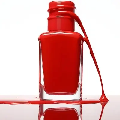 A Red Nail Polish Bottle With Nail Polish Dripping Down The Side On A Red Background 9 36ac