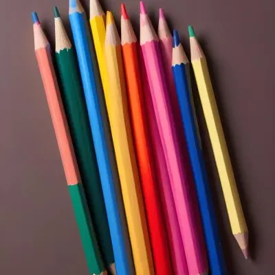 A Row Of Colored Pencils With Different Colors Red Yellow Blue Orange Pink On A Squared Paper Background 4 Bb01 9f20