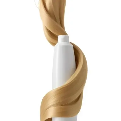 A White Bottle Of Shampoo With A Pump Wrapped In A Strand Of Long Blonde Hair On A White Background 33 81be