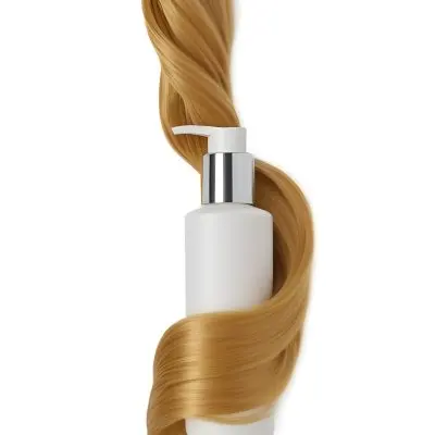 A White Bottle Of Shampoo With A Pump Wrapped In A Strand Of Long Blonde Hair On A White Background 37 19da