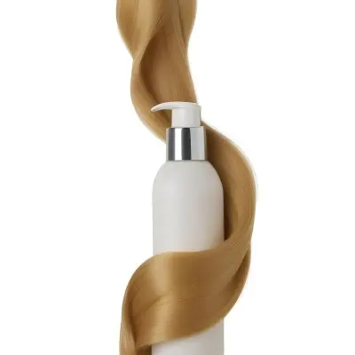 A White Bottle Of Shampoo With A Pump Wrapped In A Strand Of Long Blonde Hair On A White Background 42 2678