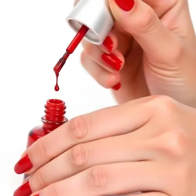 A Woman S Hands With Red Nail Polish One Hand Holding The Brush With A Drop Falling Into The Open Bottle White Background 7 F3f6