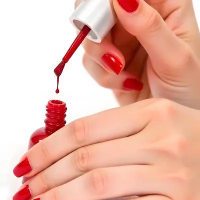 A Woman S Hands With Red Nail Polish One Hand Holding The Brush With A Drop Falling Into The Open Bottle White Background 9 8839