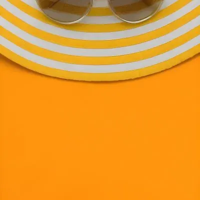 A Yellow And White Striped Hat On An Orange Backgr 12 D1b7