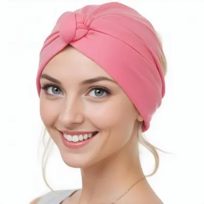 A Young Caucasian Woman With Long Blonde Hair Wearing A Pink Turban Style Headwrap Smiling At The Camera 8 1e8b