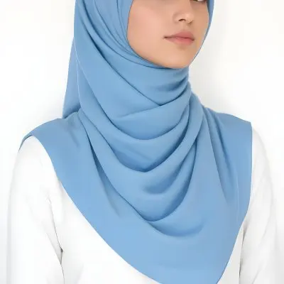 A Young Middle Eastern Woman Wearing A Light Blue Hijab Looking Directly At The Camera With A Serious Expression 27 0ce2