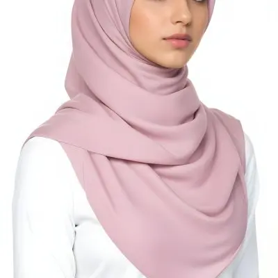 A Young Middle Eastern Woman Wearing A Pink Hijab Looking Directly At The Camera With A Serious Expression In Daylight 28 A85f