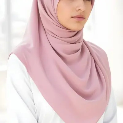 A Young Middle Eastern Woman Wearing A Pink Hijab Looking Directly At The Camera With A Serious Expression In Daylight 35 8fa4