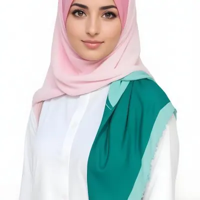 A Young Middle Eastern Woman With Brown Eyes And Long Dark Hair Wearing A Pink Hijab And A Green Scarf Looking Directly At The Camera With A Slight Smile 2 08cb