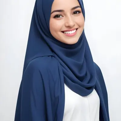A Young Middle Eastern Woman With Dark Hair Wearing A Blue Hijab And Smiling At The Camera 19 A8fd
