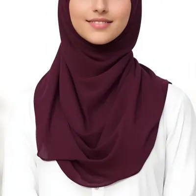 A Young Middle Eastern Woman With Dark Hair Wearing A Burgundy Hijab Smiling At The Camera 10 E333