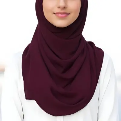 A Young Middle Eastern Woman With Dark Hair Wearing A Burgundy Hijab Smiling At The Camera 15 Ff17