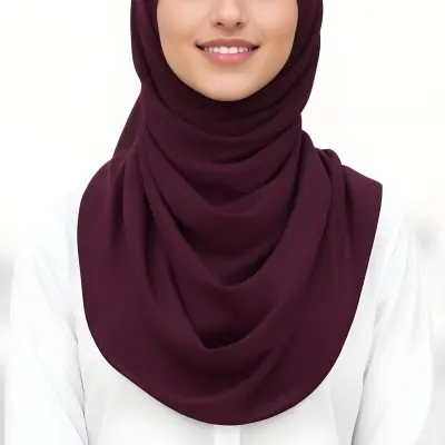 A Young Middle Eastern Woman With Dark Hair Wearing A Burgundy Hijab Smiling At The Camera 16 D602