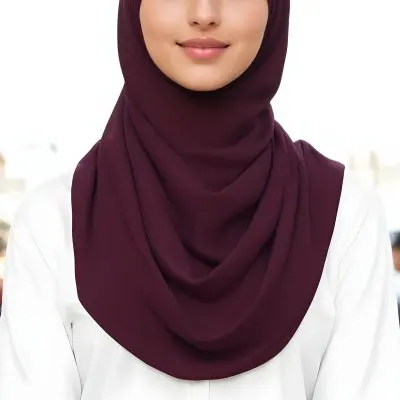 A Young Middle Eastern Woman With Dark Hair Wearing A Burgundy Hijab Smiling At The Camera 17 1bc2