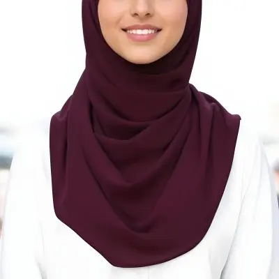 A Young Middle Eastern Woman With Dark Hair Wearing A Burgundy Hijab Smiling At The Camera 19 2f85