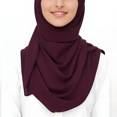 A Young Middle Eastern Woman With Dark Hair Wearing A Burgundy Hijab Smiling At The Camera 23 21e8
