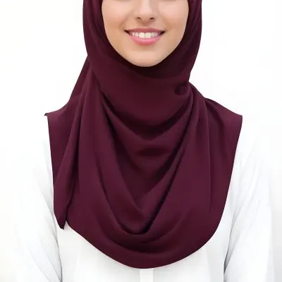 A Young Middle Eastern Woman With Dark Hair Wearing A Burgundy Hijab Smiling At The Camera 4 C134