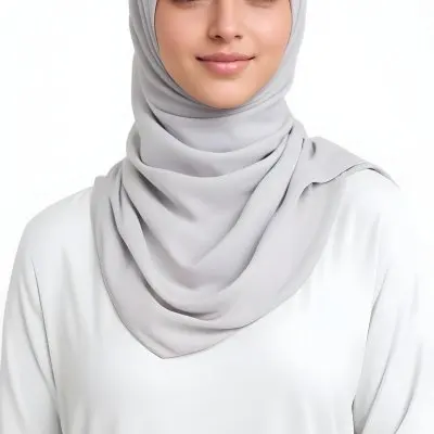 A Young Middle Eastern Woman With Dark Hair Wearing A Gray Hijab Smiling At The Camera 5 B8e4