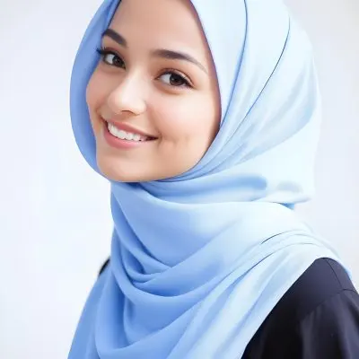 A Young Middle Eastern Woman With Dark Hair Wearing A Light Blue Hijab Smiling At The Camera 9 F8cd