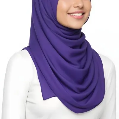 A Young Middle Eastern Woman With Dark Hair Wearing A Purple Hijab Smiling At The Camera 2 39ef