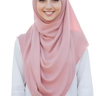 A Young Woman With Light Brown Skin Wearing A Pink Hijab And Smiling At The Camera 17 7003