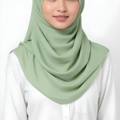 A Young Woman With Light Skin Brown Eyes And Long Dark Hair Wearing A Green Hijab And A White Shirt 15 6f52