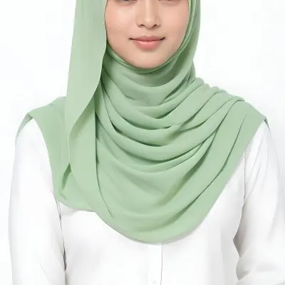 A Young Woman With Light Skin Brown Eyes And Long Dark Hair Wearing A Green Hijab And A White Shirt 18 E62d