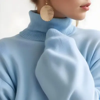 A Young Woman With Long Light Hair Wearing A Light Blue Turtleneck Sweater And Large Round Earrings 12 Cf69