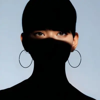 An Asian Woman 23 Years Old With Short Blue Hair And Hoop Earrings Half Of The Face Is In The Shadows Light Blue Background 27 Fd0e 278b