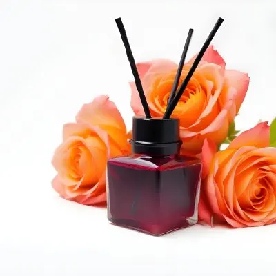 Aromatic Essence In A White Glass Bottle With Glass Sticks Surrounded By Three White Roses On A Black Background 21 08e4
