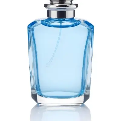 Blue Glass Perfume Bottle With A Silver Cap On A White Background 44 02ef