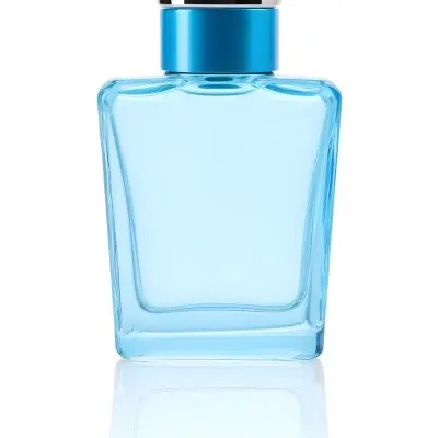 Blue Glass Perfume Bottle With A Silver Cap On A White Background 50 10a5