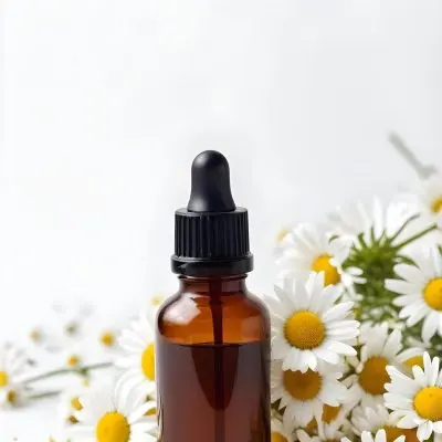 Brown Glass Bottle With Dropper Surrounded By Chamomile Flowers White Background 21 4b56