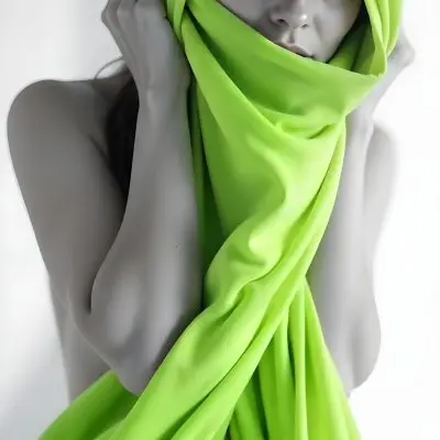 Caucasian Woman Age 25 With Brown Hair Partially Covered By A Vibrant Green Fabric In A Minimalist Gray And White Indoor Setting 12 B2fb