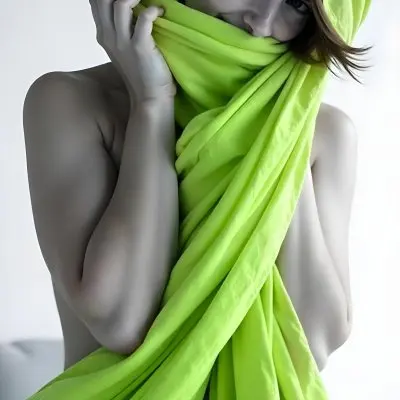 Caucasian Woman Age 25 With Brown Hair Partially Covered By A Vibrant Green Fabric In A Minimalist Gray And White Indoor Setting 13 A5d7